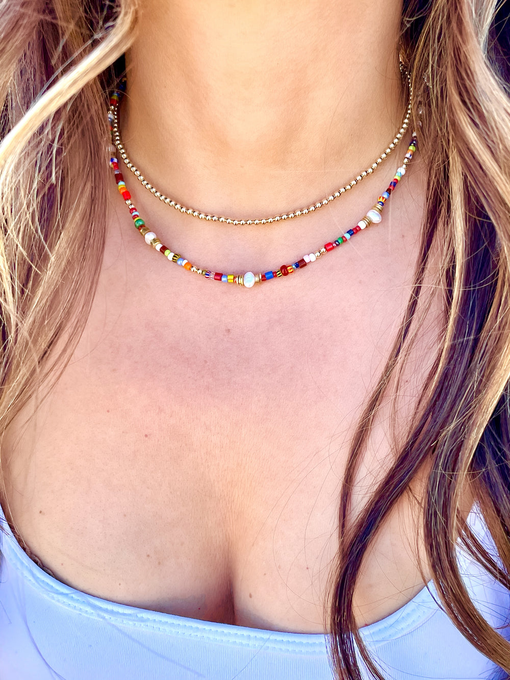 https://www.oliviale.com/cdn/shop/products/Olivia-Le-Jetsetter-beaded-necklace-model-shot.jpg?v=1621201740&width=1000